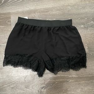 BCBGMAXAZRIA black lace hem shorts